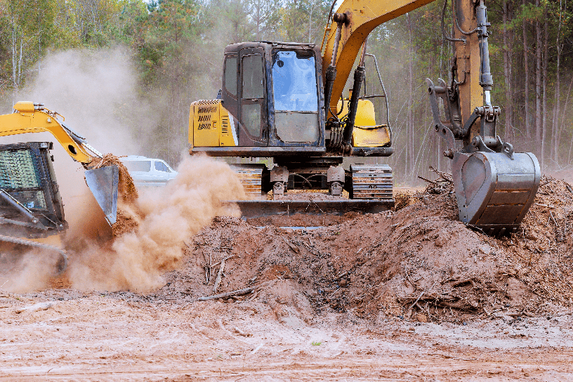 Storm response with heavy equipment removing debris after severe weather event