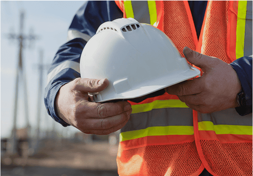 Safety is a top priority - construction worker holding helmet