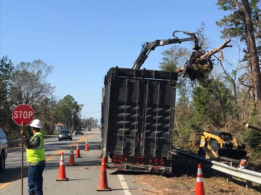 Storm response with debris and clean up efforts along road after Hurricane milton