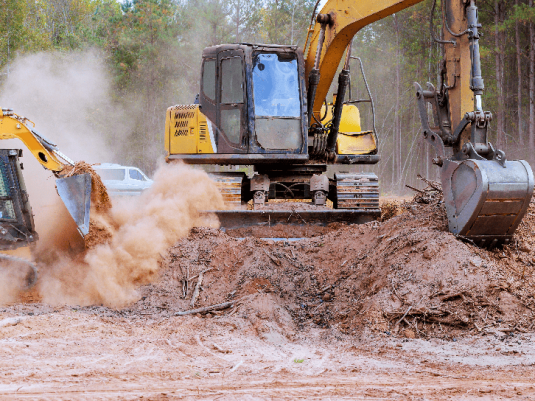 Storm response with heavy equipment removing debris after severe weather event
