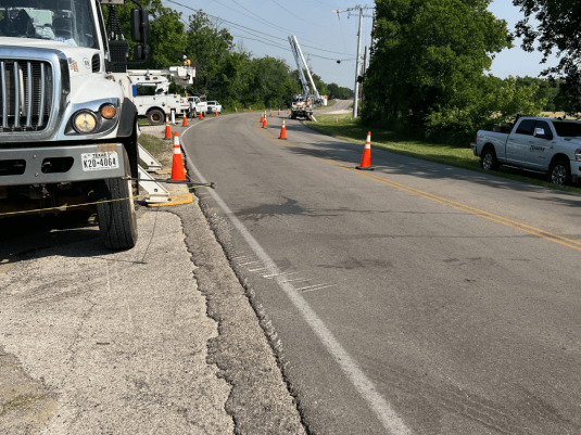 Storm-damaged utility lines and with MO Company crew on-hand to repair after severe weather event
