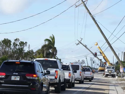 Storm-damaged utility poles and wires after severe weather event