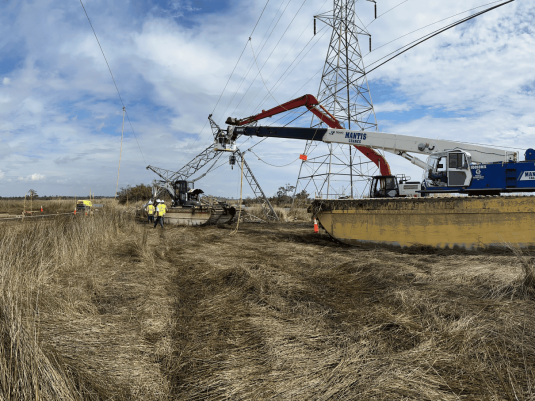 Storm-damaged utility poles and wires after storm